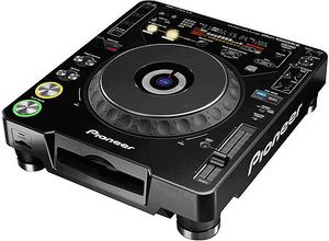 The Pioneer CDJ1000. Many consider this to be an industry standard, although it does not pack in as many features as some other players. Note the large touch sensitive control wheel on the top of the unit.