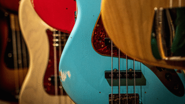 Active and passive bass guitars side by side showing pickups, controls, and electronics differences