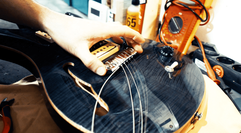 Change strings on an electric guitar