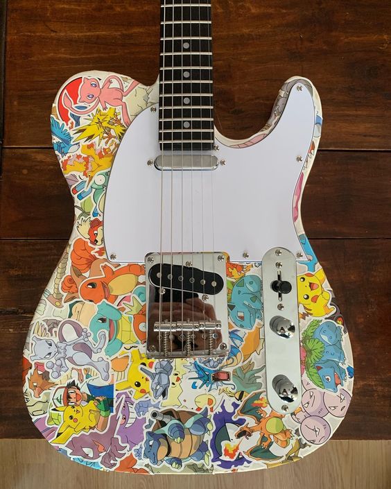A T-style guitar covered in Pokemon stickers